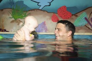 JUMP! Swim Schools managing director Ian Campbell with his three-month-old son Reed.